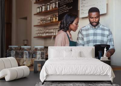 Two African entrepreneurs working behind their cafe counter Wall mural