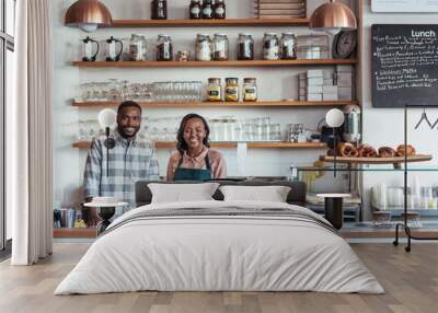 Two smiling young African entrepreneurs standing at their bakery counter Wall mural