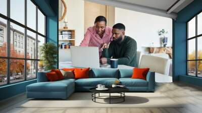 Young African American doing online banking together at home Wall mural