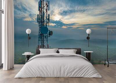 Aerial view of telecommunication tower with sunrise background. Wall mural