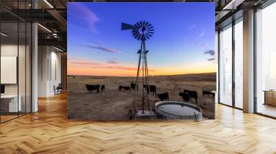 Ellis County, KS USA Traditional Wind Mill on a Midwestern Cattle Farm at Sunset Wall mural