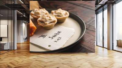 Carrot and yummy mince pies on a dish with a note 