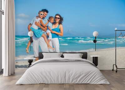 family having fun on tropical beach Wall mural