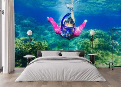 girl dives in a tropical sea Wall mural