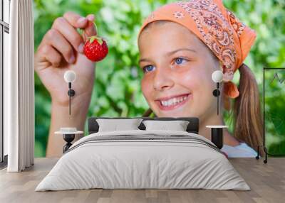 Girl eating strawberries Wall mural