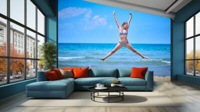 Happy Girl having fun on tropical beach Wall mural