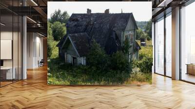 View of an old abandoned dilapidated wooden house Wall mural