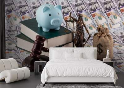 Themis figure, a judge's gavel, a book, a piggy bank and a money bag with an American dollar symbol on a background of 100 dollar bills in the USA Wall mural