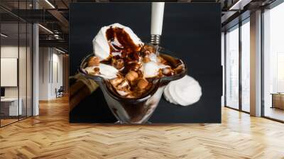 Vanilla ice cream with chocolate topping on the wooden background. Shallow depth of field. Wall mural