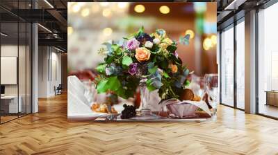 Beautiful flowers on table in wedding day. Decoration of wedding table with flowers. Beautiful wedding restaurant for marriage. Colorful decoration for celebration. Bouquet and flowers in hall. Wall mural