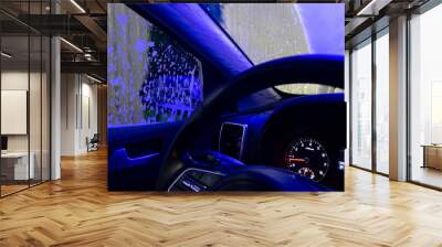 Automatic conveyorized tunnel car wash. A view from inside.
 Wall mural