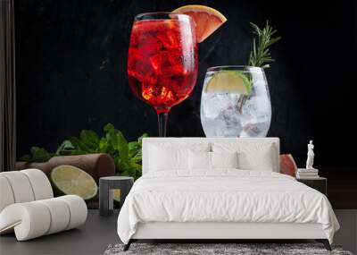 alcoholic cocktails based on Campari and Martini with lemon and lime Wall mural