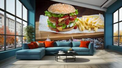 hamburger with French fries on the Board, side view Wall mural