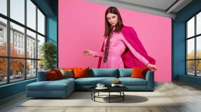 Fashion model in magenta jacket, pink skirt and shirt. Wall mural