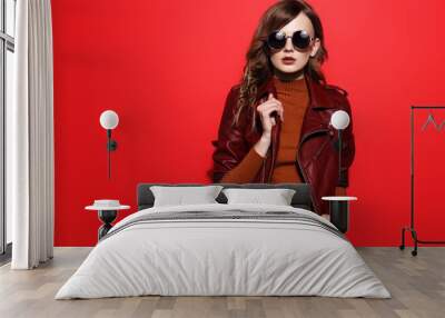 fashion model in sunglasses, beautiful young woman. leather jacket, studio shot Wall mural