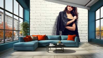 fashion model in sunglasses, black leather jacket, leather pants Wall mural