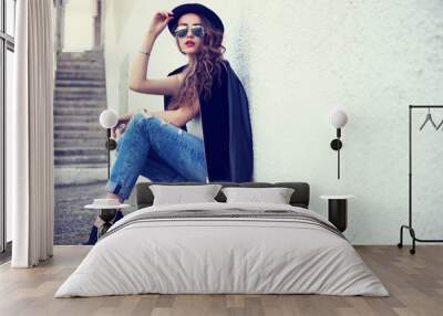 fashion model in sunglasses posing outdoor Wall mural