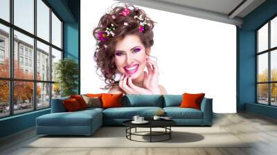 Happy young woman with flowers in her hair and bright makeup iso Wall mural