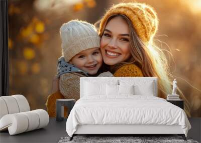 Enjoying autumn's beauty with a mother and son in the park Wall mural