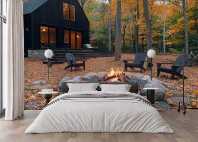 Firewood burns in a stacked stone firepit with flames. Beautiful autumn scenery. Wall mural