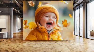 Happy and joyful toddler in autumn park. Leaves falling. Wall mural