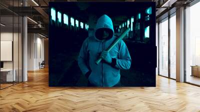 Aggressive man with a baseball bat wearing hoody Wall mural