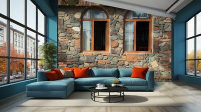 new, modern Wall of building made from cobble stone with 2 two  arched windows. exterior background. wooden antique vintage window frames in red brown brick wall. old fashion style Wall mural