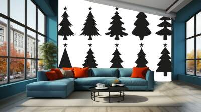 Christmas tree icons isolated on white background. Black vector silhouettes of christmas trees with a stars at the top. Wall mural