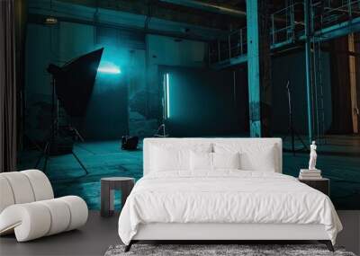 Film shooting location in an industrial setting, featuring professional lighting equipment and a dark backdrop. A moody atmosphere, highlighting the preparation for a film shoot. Wall mural