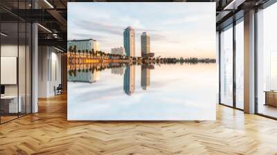 Amazing reflection of the famous tower of Barcelona, Hotel Arts and Mapfre Tower, in front of the beach during a sunny day in Barcelona, Spain. Wall mural