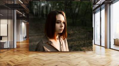 portrait of a girl in the forest with brown hair Wall mural