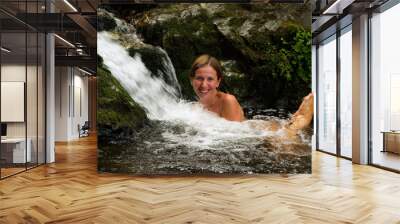 laughing girl bathing in the forest waterfall Wall mural