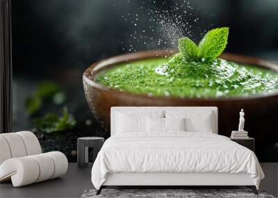 A fresh minty green paste fills the wooden bowl, adorned with a fresh mint sprig on top, set against a dark background, capturing a refreshing essence. Wall mural