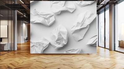 An abstract composition of crumpled pieces of white paper on a clean white background, highlighting the randomness and texture inherent in the wrinkled papers. Wall mural