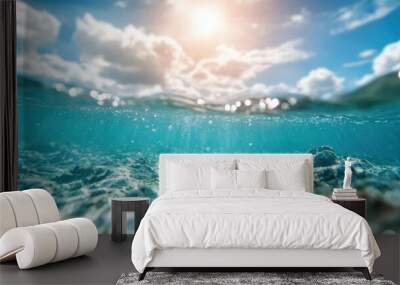 Captures the beauty of ocean waves gently rolling, with sunlight sparkling across the water's surface and a picturesque sky reflected in the tranquil seascape. Wall mural