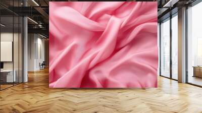 The image showcases smooth, flowing folds of pink fabric, highlighting a soft texture that creates an elegant and calming visual effect. Wall mural