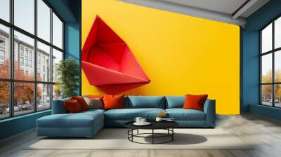 Red Origami Boat on Bright Yellow Background Wall mural