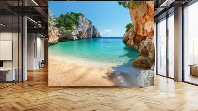 A beautiful beach with a clear blue ocean and a rocky cliff in the background. The scene is serene and peaceful, with the sound of waves crashing against the shore. The water is calm and inviting Wall mural