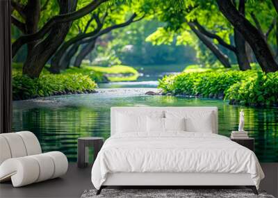 A green river with trees on either side. The water is calm and the trees are lush and green Wall mural