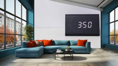 Black digital clock on a white background showing time 3:50 Wall mural