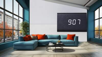 Black digital clock on a white background showing time 9:07 Wall mural