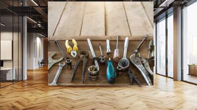 Mechanic tool placed on old wooden table, Close up to object in the middle, Copy-space. Wall mural