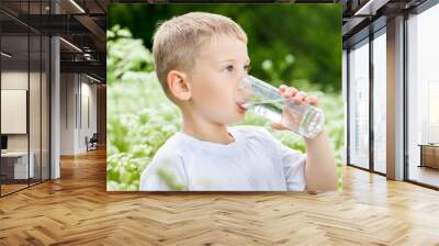 Child drinking pure water Wall mural