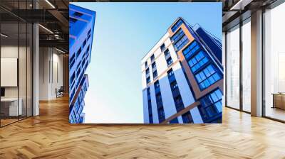 Building exterior on blue sky. New house, home complex. Facade building background. Modern building, houses with glass windows. New Buildings architecture. European residential apartment. Condominium Wall mural