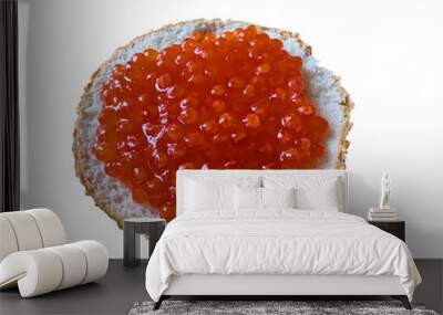 Red caviar on a bun isolated on white background. Bun with red caviar on isolated on white. Wall mural