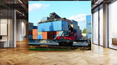 Shipping container loading by richtracker on the freight rail car at logistic warehouse port. Ocean Freight Cargo Shipping, Intermodal Container Freight concept - Image Wall mural