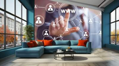 Businessman pushing virtual web button www icon Wall mural