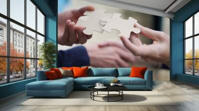 two men handshake trying to connect couple puzzle piece.symbol of association and connection. busine Wall mural