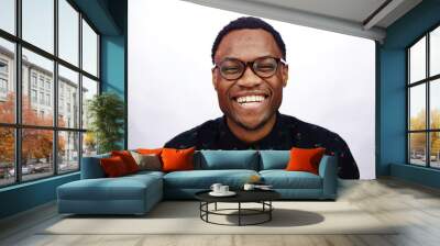 attractive young black male studio laughing and smiling Wall mural