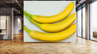 Bananas and other fruits in a gray . banana healthy food concept. tropical fruits on a gray with bananas in yellow. tropical fruits in a gray and yellow with a banana on the side lifestyle. Wall mural